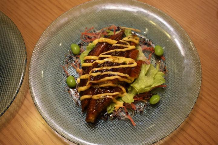 Unadon is a traditional Japanese donburi dish comprising barbecued eel on a bed of sushi rice.  Sakura, the Metropolitan hotel & Spa, New Delhi, india