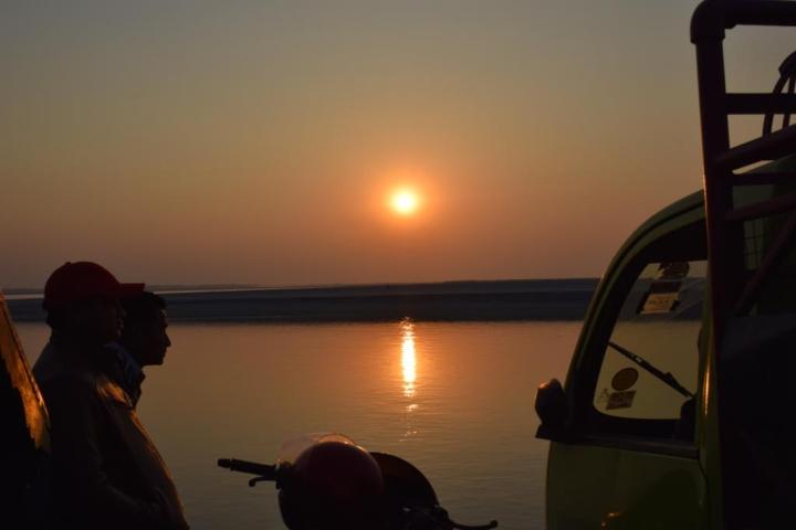 As the sun sets over the Brahmaputra, Majuli, Assam, India