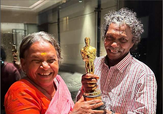 Tribal couple, Bomman and Bellie, who take care of an injured baby elephant Raghu, hold the Oscar