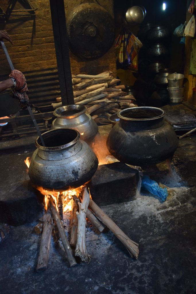 Food being cooked on firewood in Old Delhi, India