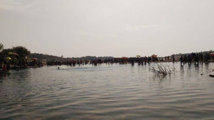 The tree stump and boat dividing India and Bangladesh, Dawki Lake, Meghalaya, India