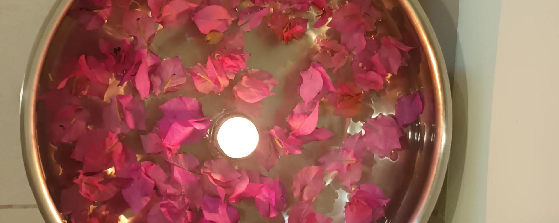 Petal filled water bowls with floating candles at Neo Veda Spa, The Metropolitan Hotel & Spa, Connaught Place, New Delhi