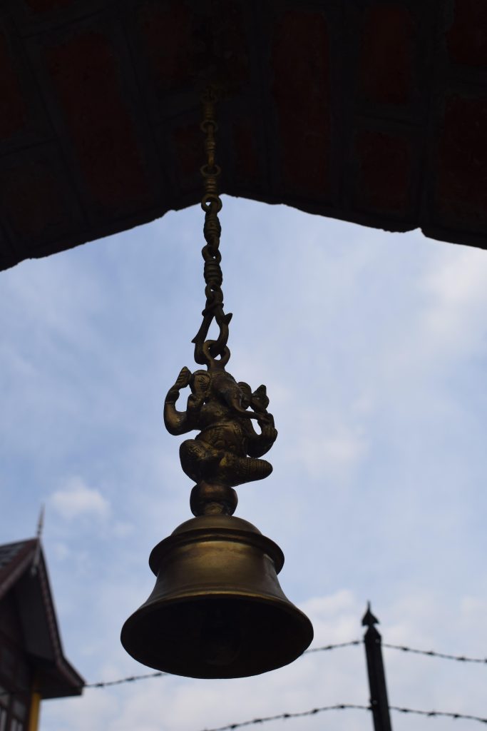 Bell with Ganesha idol at Chateau Garli, Himachal Pradesh, India