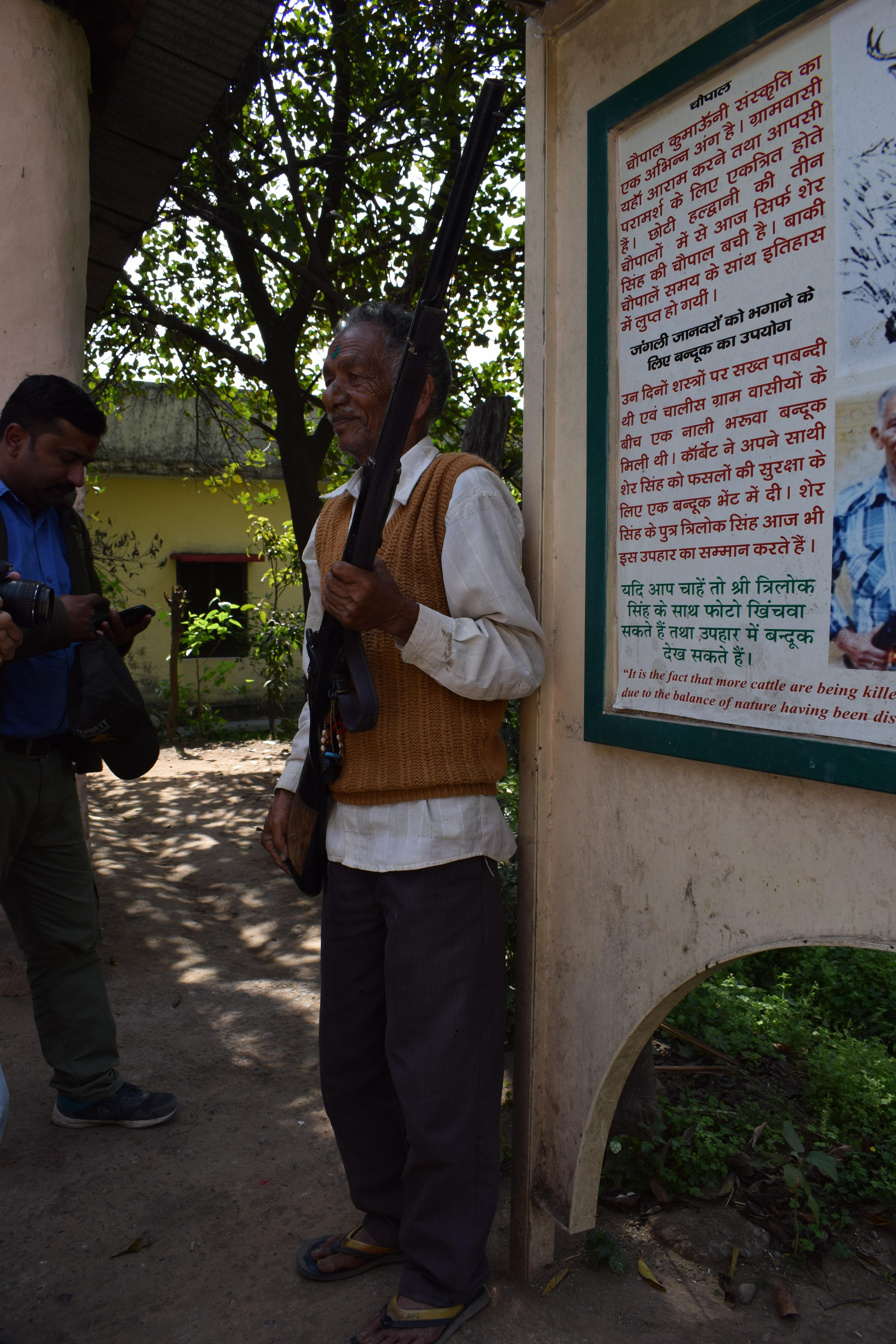 Trilok Singh Negi with gun gifted by Jim Corbett to his father, Choti Haldwani, Uttarakhand, India