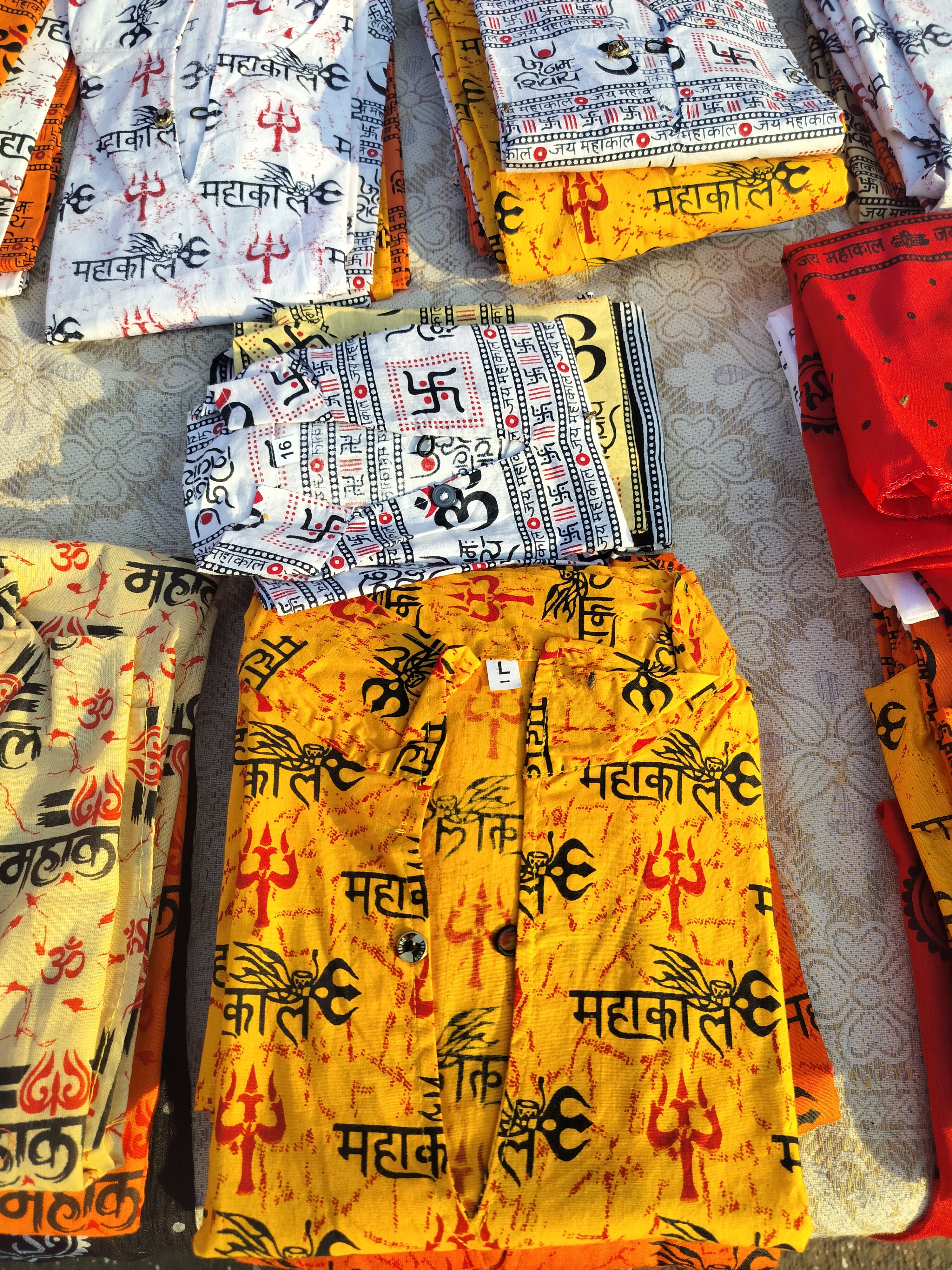 The imprinted shirts for devotees for sale outside Trimbakeshwar temple, Nashik, Maharashtra, India