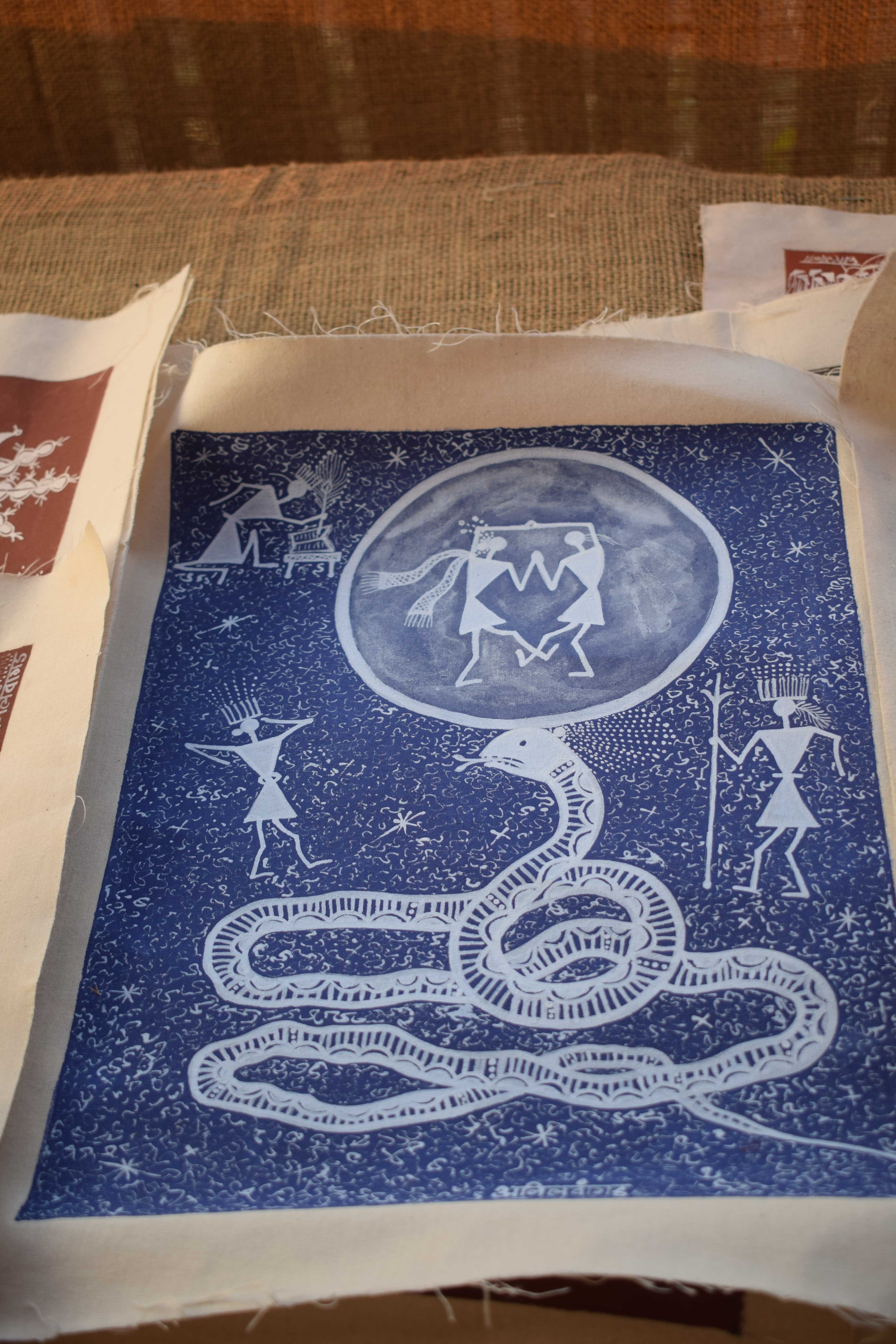 Warli art on Indigo background by Anil Vangad, Warli Artist, Gangapur Dam Backwaters, Nashik, Maharashtra, India