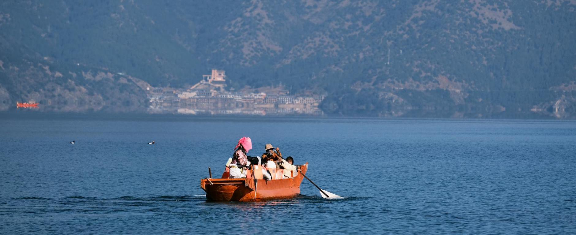 scenic boat ride on a serene mountain lake, Photo by Lily Lili on Pexels.com