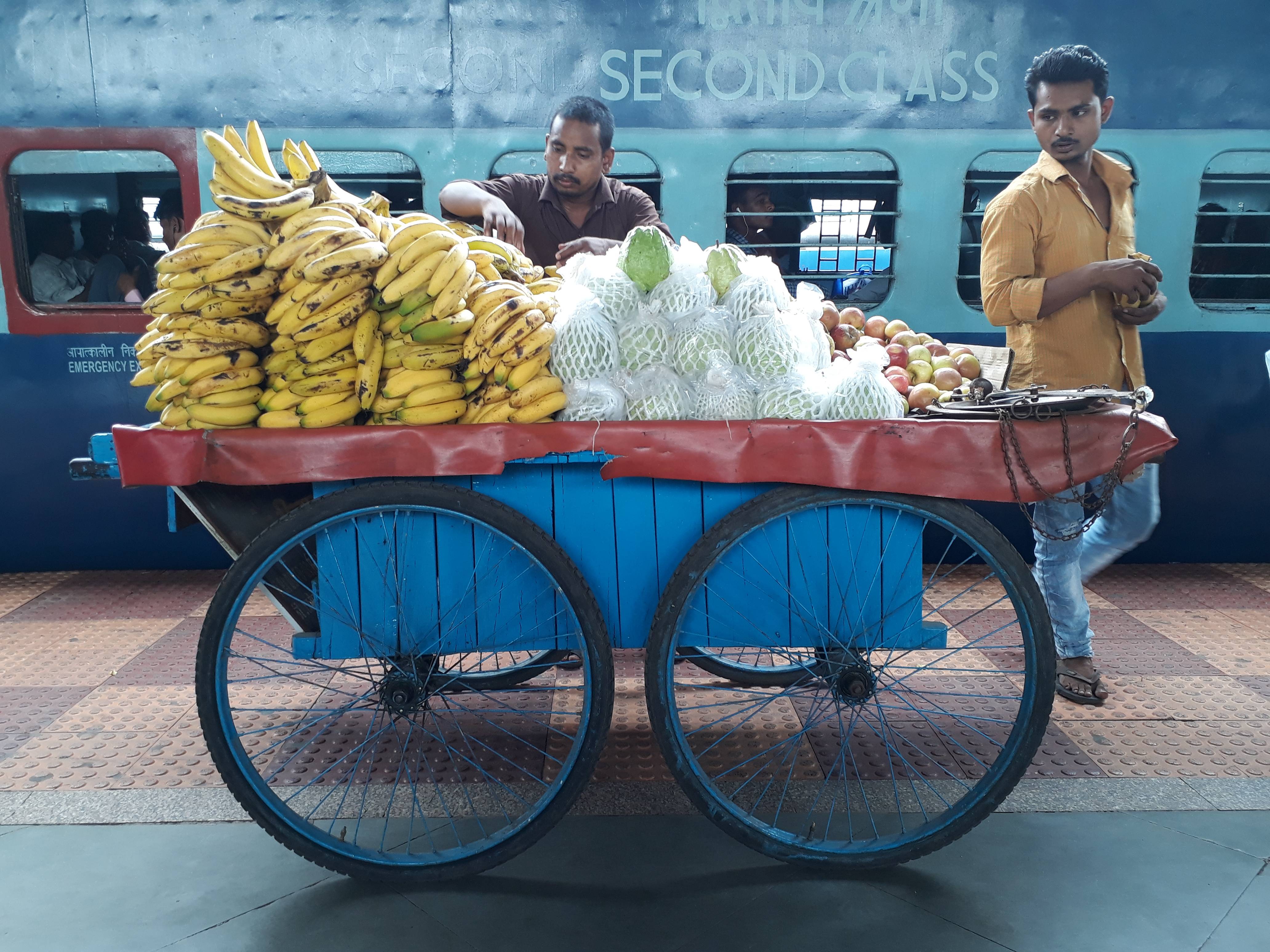 Vendor selling fruits on the railway platform in Raigarh, Chhattisgarh, India