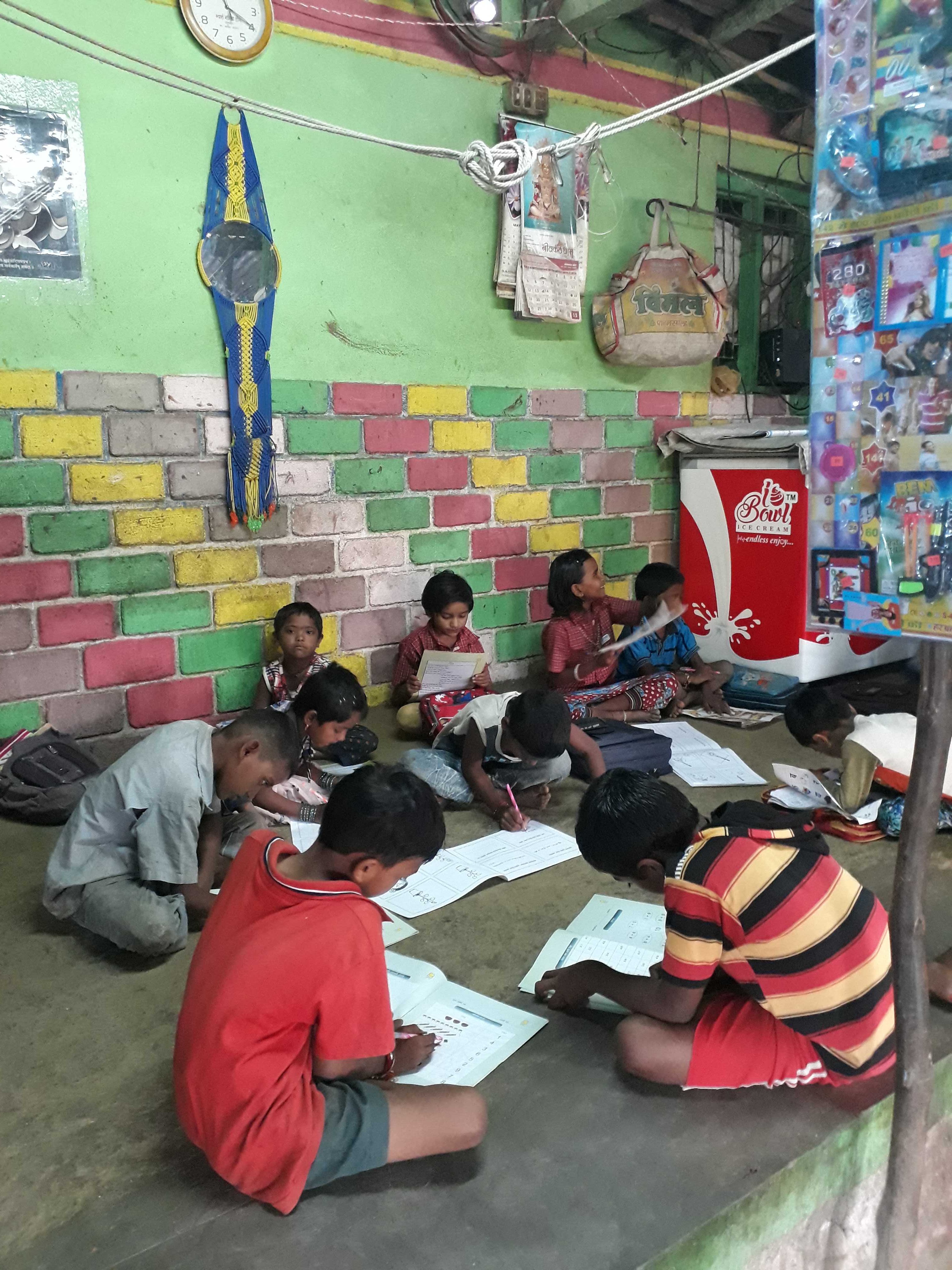 Colourful wall of this verandah in a village home make it a vibrant space for children, Nandurbar District, Maharashtra, India