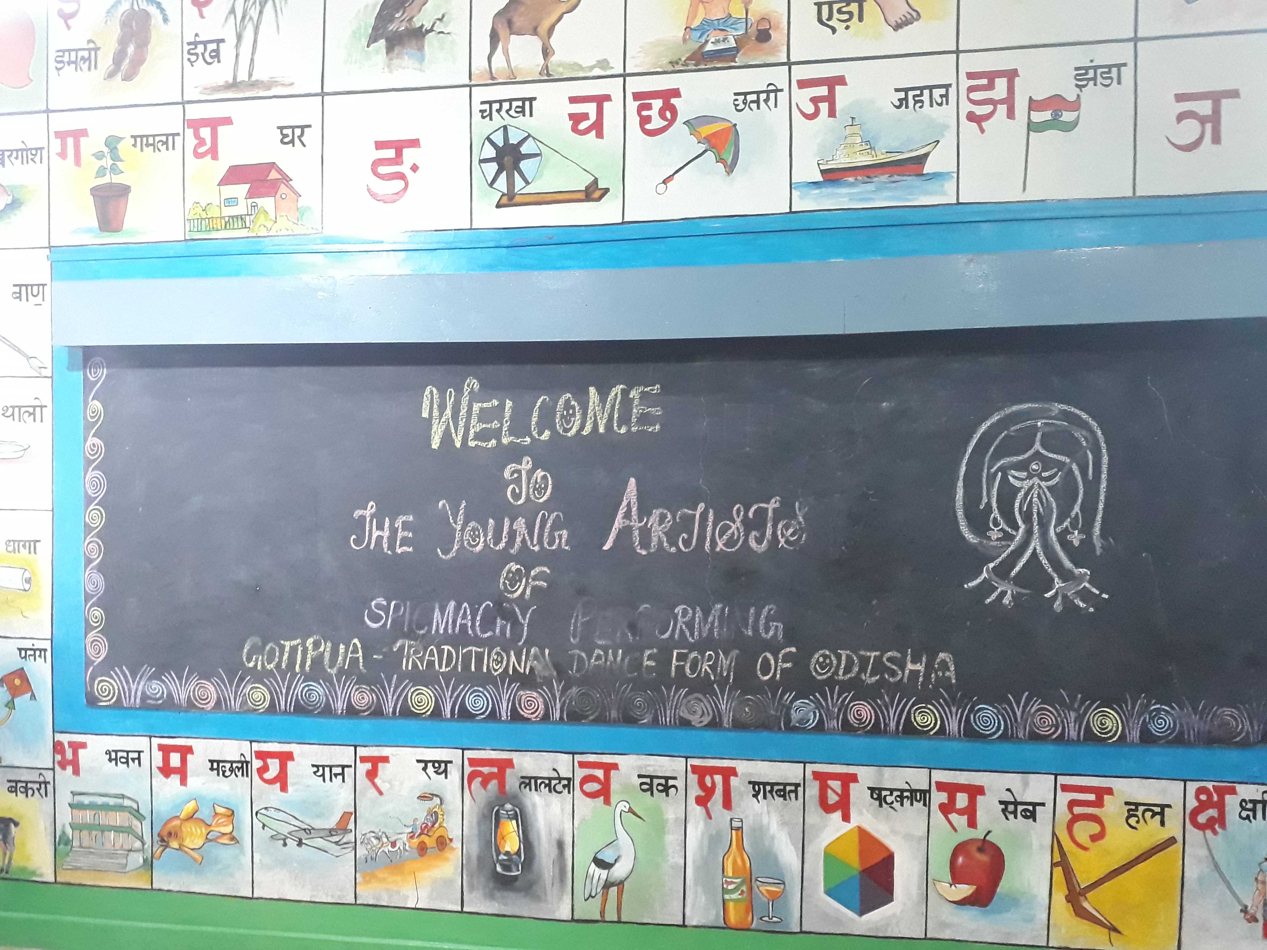 Painting educational content on walls, Kolar district, Karnataka, India