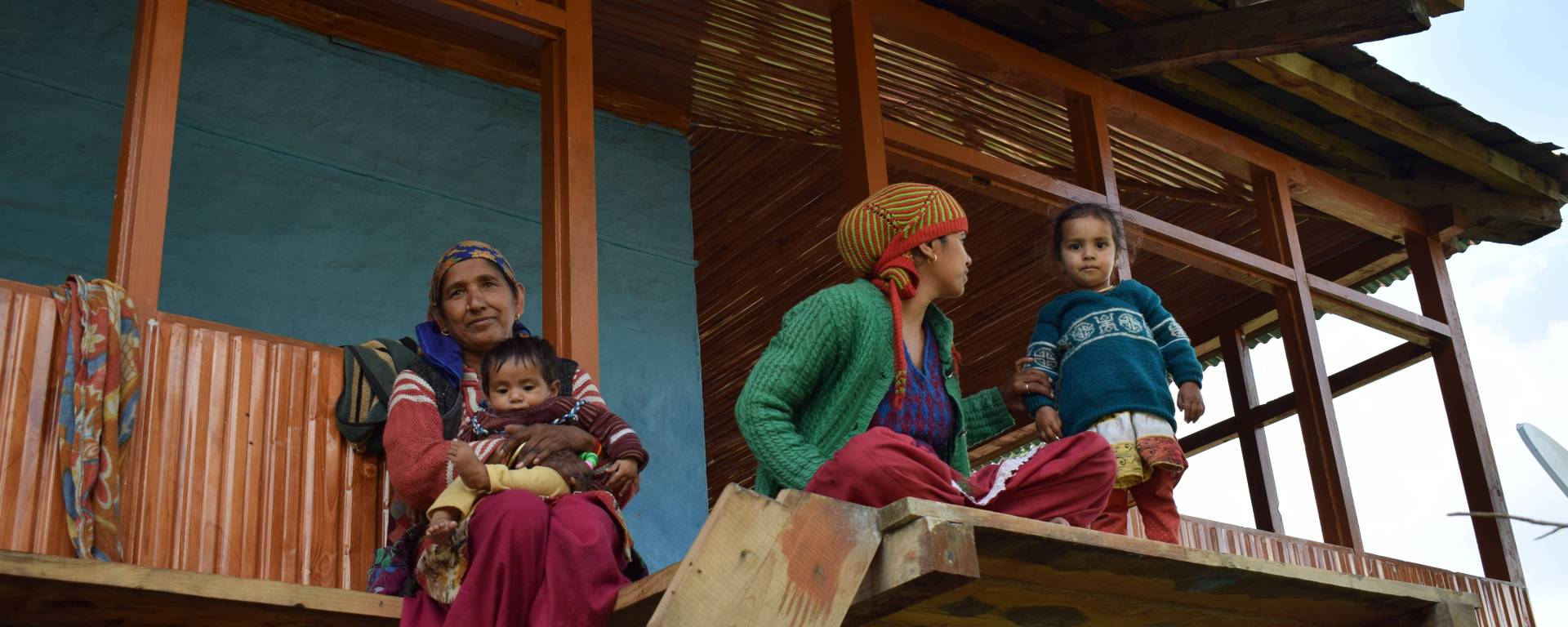 Women and children in their wooden homes, Sarchi, Himachal Pradesh, India