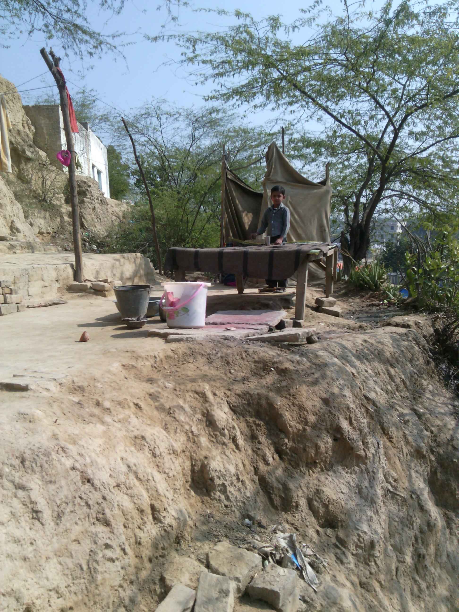 This boy and his family lived in mud homes, interiors of Uttar Pradesh, India