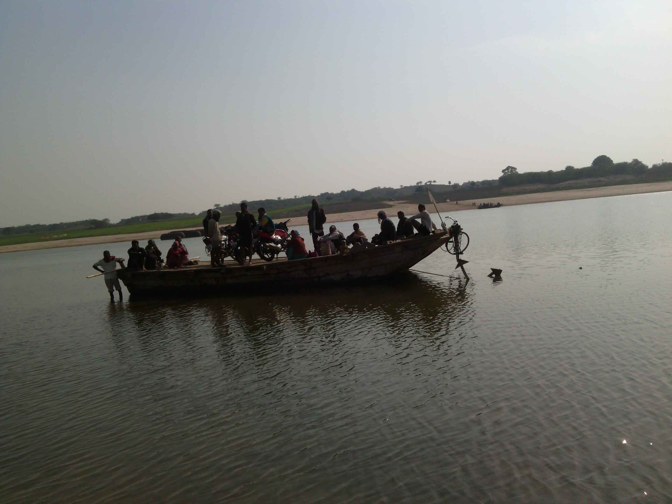 Ferry taking villagers across the shore, Chambal river, Uttar Pradesh, India
